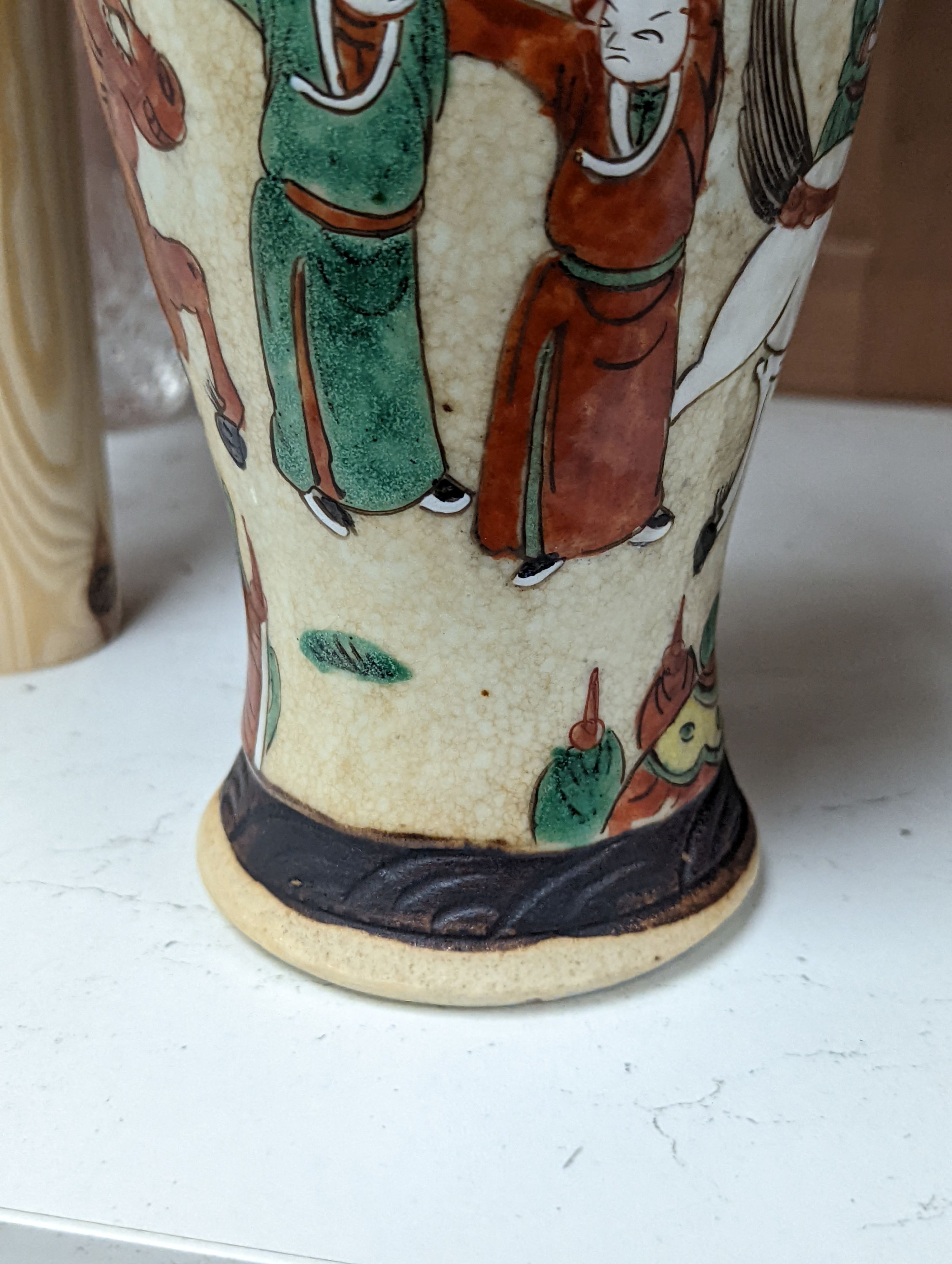 A pair of Chinese famille rose crackle glaze baluster jars and covers, 27cm.